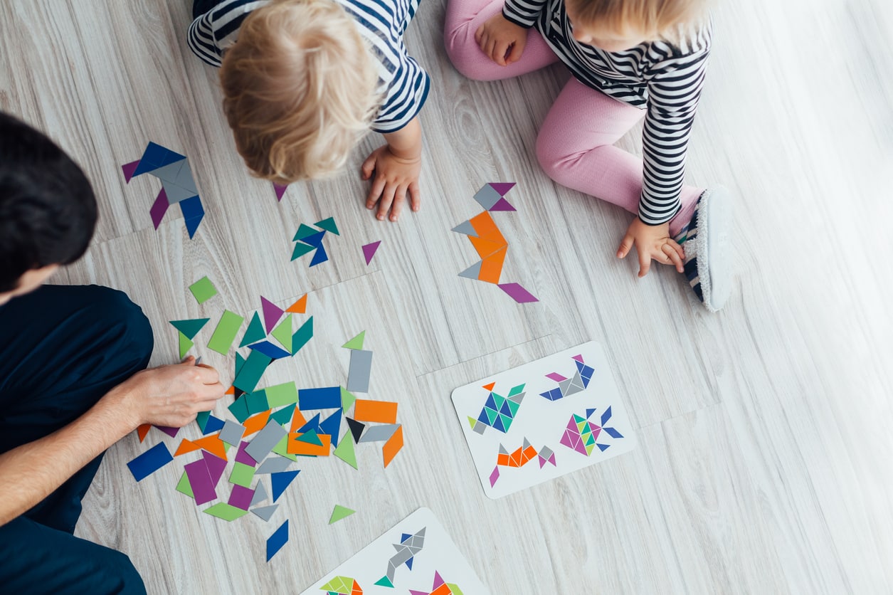 Father playing with children.